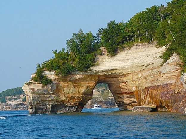 Image shows the famed rock arch formation as seen from the tour boat at Pictured Rocks National Lakeshore, Michigan.