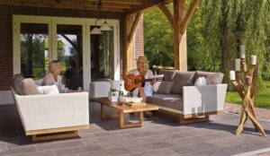 women are sitting in the backyard and enjoying music