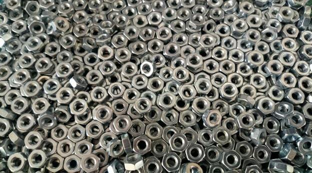 pile of silver hex nuts