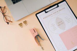 It's in the Details: Ways to Make Your Small Business Stand Out laptop and accessories on peach color office desk