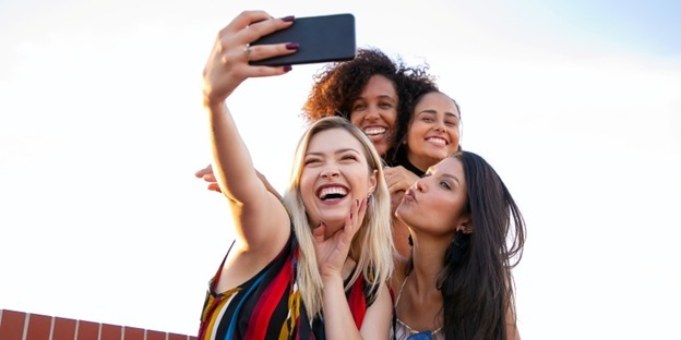 girls taking selfie