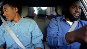 father and son arguing sitting in car