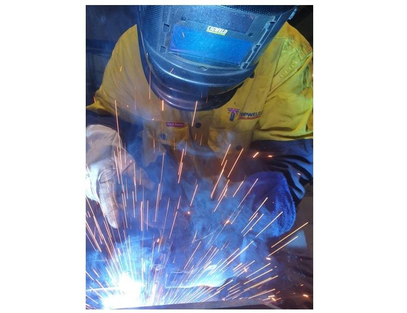 welder doing welding with safety equipment