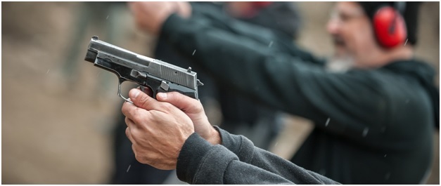 group of civilian practice gun shooting on outdoor shooting range