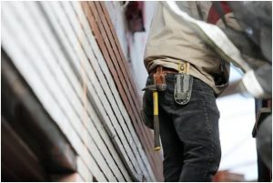 carpenter with tools in pocket