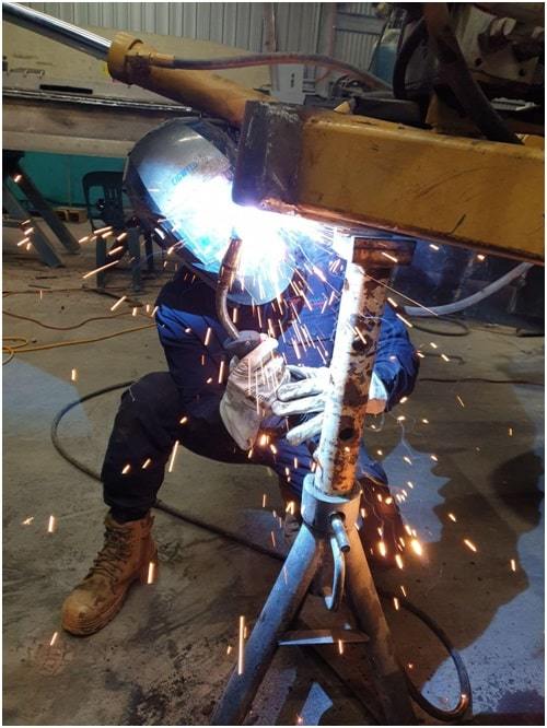 welder with safety gear while welding