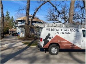 roof repair van in front of house