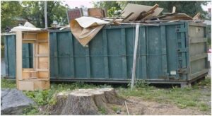 dumpster full of trash from renovation of old building