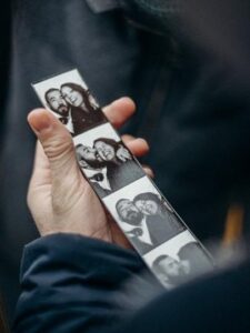 person holding white and black card