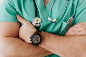 doctor hands arms crossed stethoscope