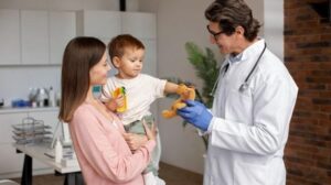 young mother with toddle at the pediatrician for a consultation