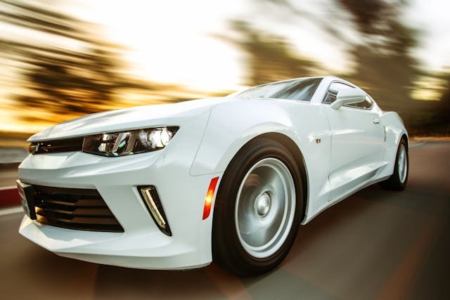 close-up photography of white chevrolet camaro