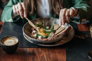 a person eating from a bowl