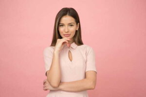 The Rise of Smart-Casual: How to Nail the Look woman wearing pink collared half-sleeved top