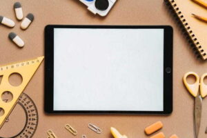 4 Reasons Schools Are Adopting Digital Classroom Solutions flat lay featuring a tablet
