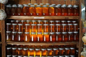 India Honey Market: A Golden Opportunity Buzzing with Growth rows of jars of honey sit on a shelf