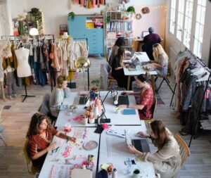 How to Choose the Right Fashion Design Institute for Your Career Goals young female fashion designers working together at the design studio