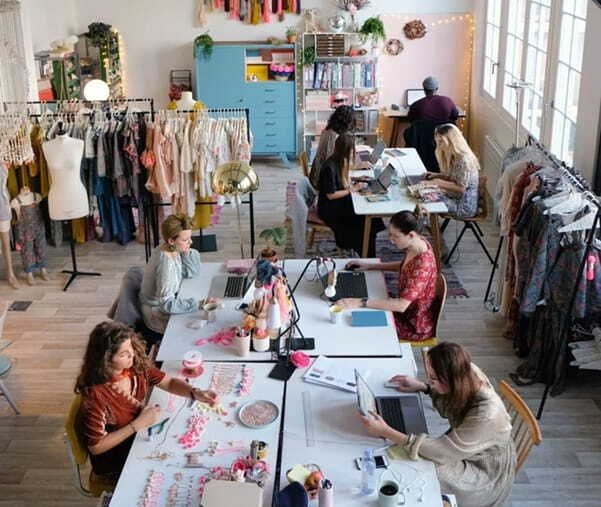 young female fashion designers working together at the design studio