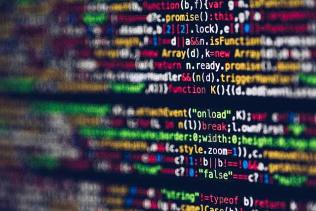 close-up of colorful code on a screen, representing web development and programming