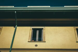 6 Factors That Influence Cold-Weather Building Performance old residential house facade in town on sunny day