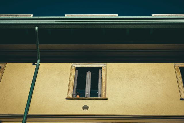 old residential house facade in town on sunny day