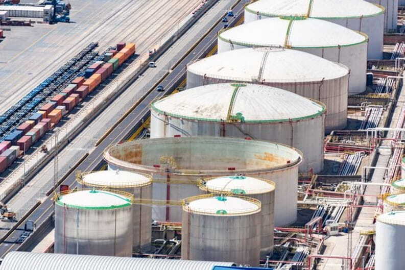 silos near cargo train cars