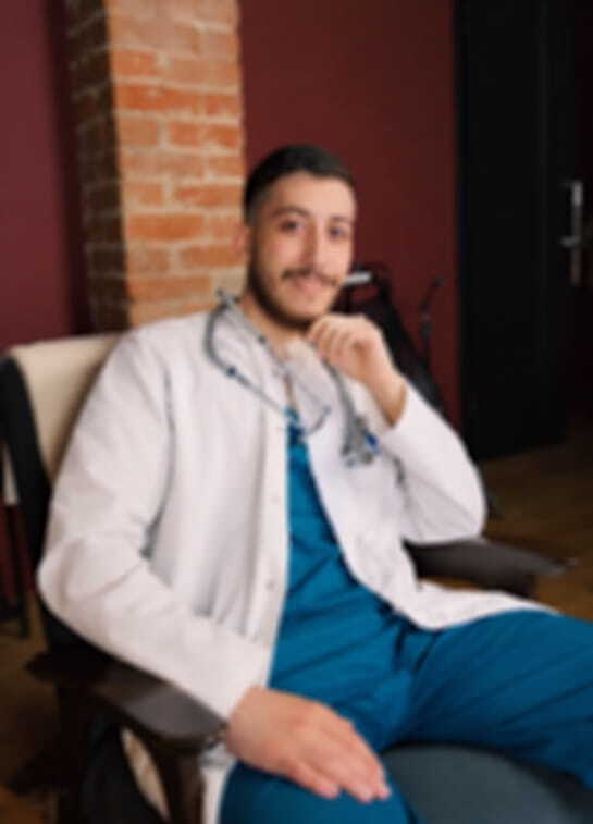 smiling male doctor in modern clinic setting